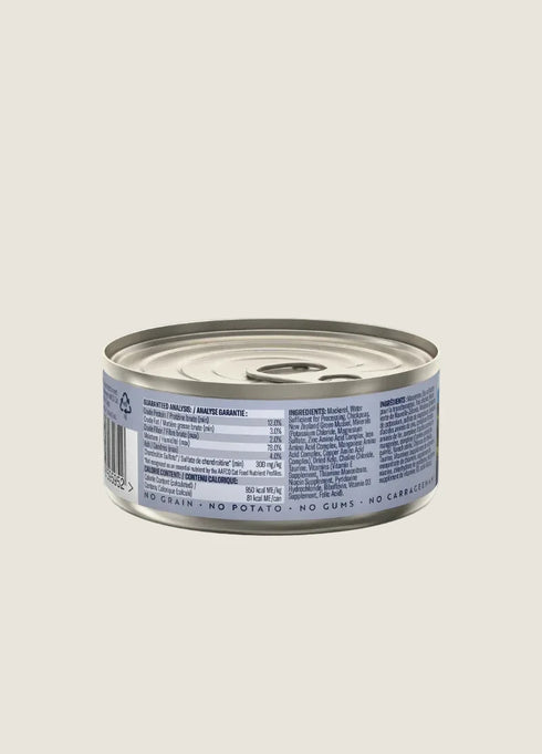 A can of ZIWI Peak Canned Mackerel Cat Food is shown from the side, displaying the nutrition label and ingredients list. The can features a silver lid and a light-colored background, emphasizing the products branding and details.