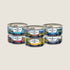 A variety pack of ZIWI Peak wet cat food featuring six 85g cans, each labeled with distinct flavors including mackerel, lamb, venison, and chicken. The cans are neatly arranged in two rows, showcasing vibrant packaging designs.