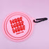 A pink collapsible silicone dog water bowl features the text WOOF WOOF WOOF in bold red letters, along with the brand name Pablo & Co. It is designed with a carabiner clip for easy attachment to bags or leashes.