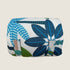 A rolled-up travel mat featuring a vibrant coastal pattern with bold blue, green, and orange leaves. The design showcases a mix of various palm and foliage shapes, emphasizing a tropical aesthetic ideal for outdoor adventures.