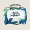 The image shows a compact travel mat with a colorful leaf design in shades of blue, green, and orange. It features a white label with the text Indie Boho prominently displayed on the front, along with a sturdy handle for easy carrying.