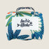 The image shows a compact travel mat with a colorful leaf design in shades of blue, green, and orange. It features a white label with the text Indie Boho prominently displayed on the front, along with a sturdy handle for easy carrying.