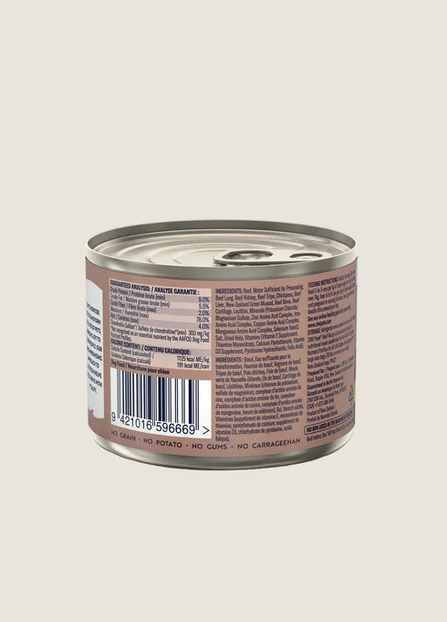 A 170g can of ZIWI Peak Canned Beef Dog Food, showing the back label with nutritional information and ingredient list. The can features a silver lid and a beige background, highlighting details about the products quality and sourcing.