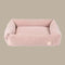 A soft blush corduroy pet bed with a rectangular shape and plush, padded edges. The bed features a removable cover for easy cleaning, showcasing a luxurious.
